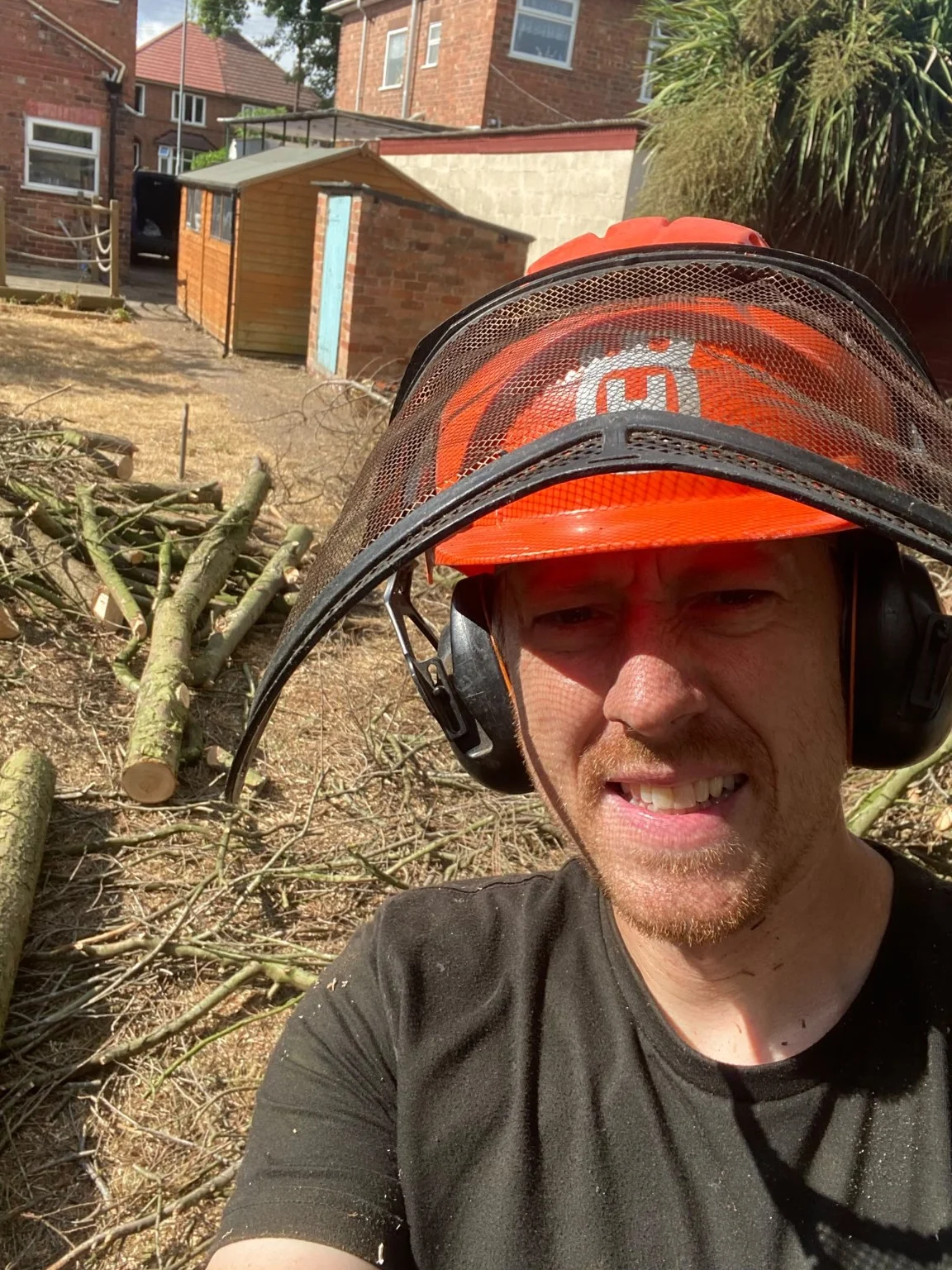 Genuine photograph of John in arborist protective equipment